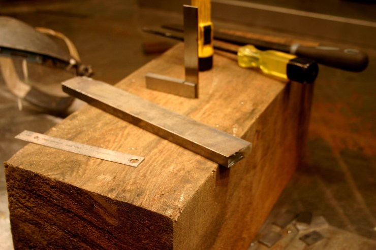 Starting with 1/2" x 1.5" steel bar.