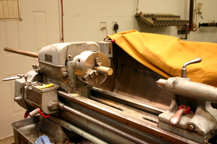 Mount an old boat propeller shaft in the lathe.