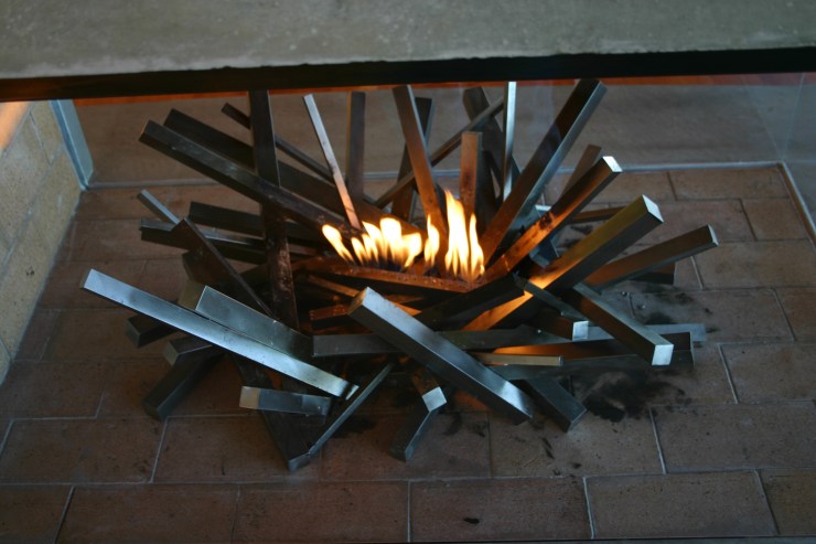Custom log lighter burner is incorporated in the design.